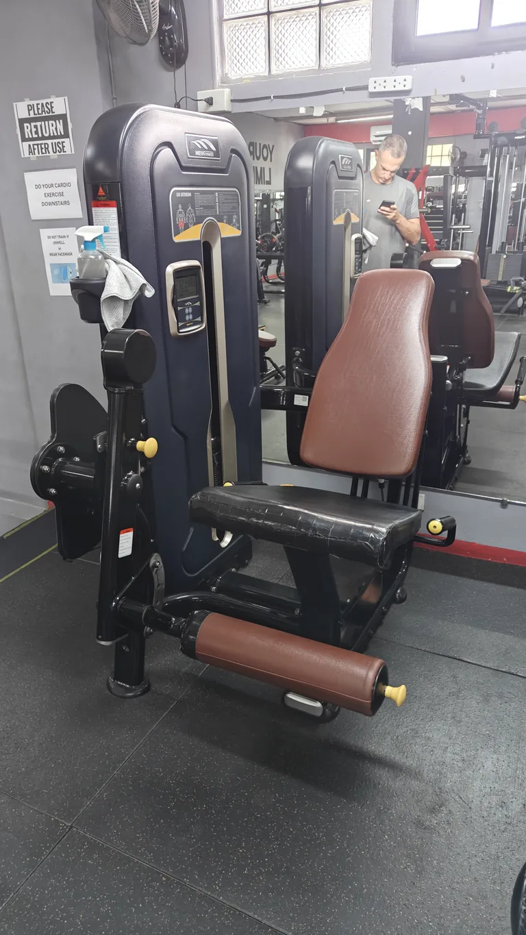 Seated leg extension machine at TM Fitness Hub in Valencia, Negros Oriental